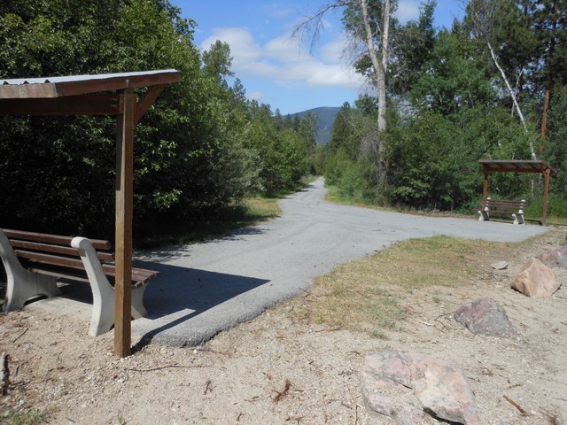 picture showing Trailhead for trail leading to Florence.  Total length is about 1.25 miles.  Parking is not marked but one could parallel park along the gravel road.  The trail is for both pedestrians and bicycles.