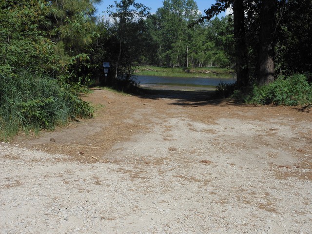 picture showing Boat launch at a max slope of 7%.  All gravel and natural dirt surface.