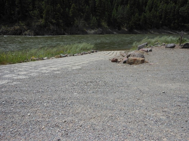 picture showing Boat ramp made of large concrete blocks.  Often during high water, the gravel gets eroded out from between the blocks and becomes quite difficult to walk on until new gravel gets added back into place.