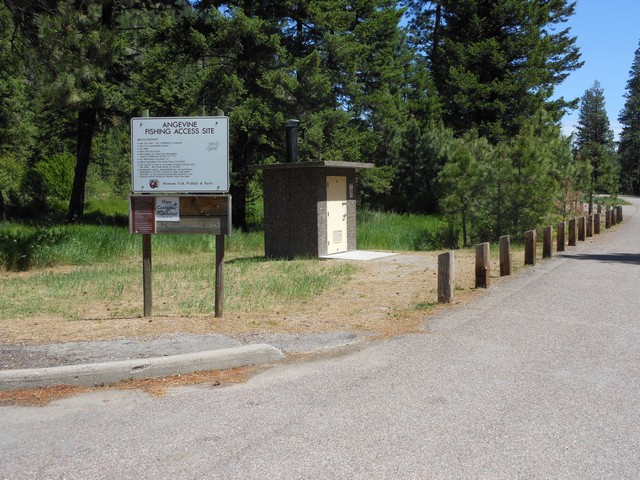 picture showing Nice paved road system, regulation sign and latrine.