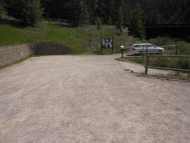 picture showing The space to manuever a vehicle with a trailer is tight but doable.  Notice the loading/unloading parking space.  This is a good access point upriver from Johnsrud.  During the 6 weeks of hot summer, this is the main launch site for the tubers, especially weekends.