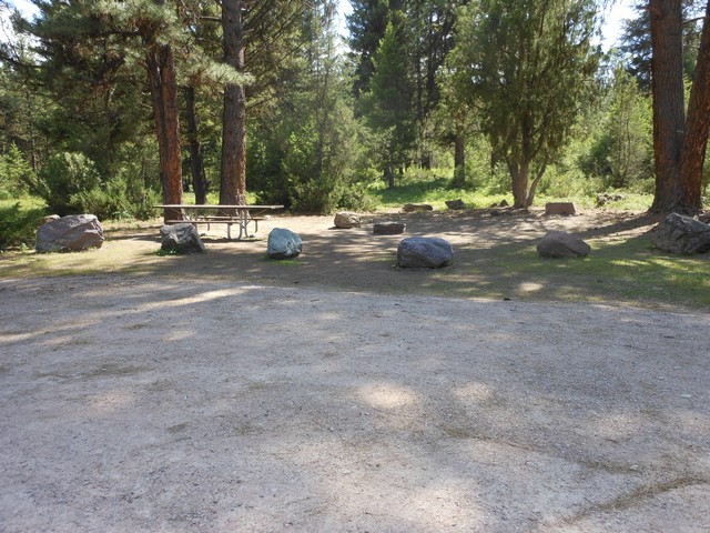 picture showing Nicely sized parking pad with campsite.