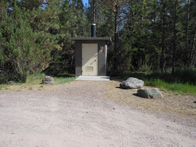 picture showing Latrine located at end of parking area.  