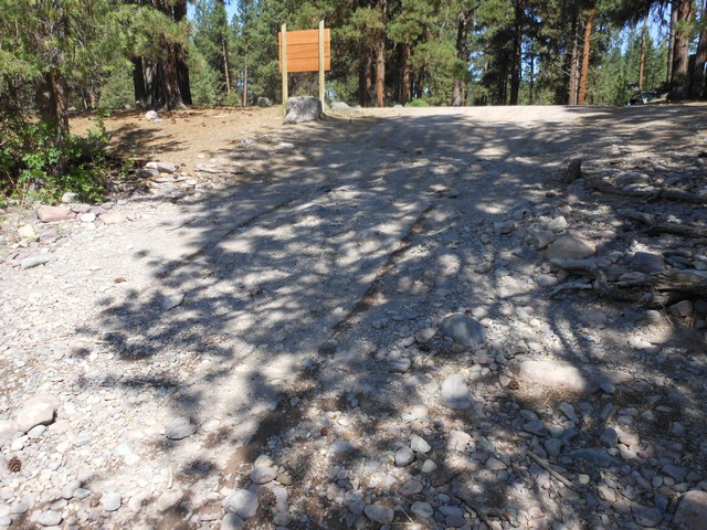 picture showing Standing at river's edge looking up the ramp.  It is quite rocky and eroded.