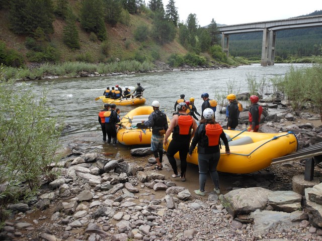 picture showing Group of rafters launching into the river.