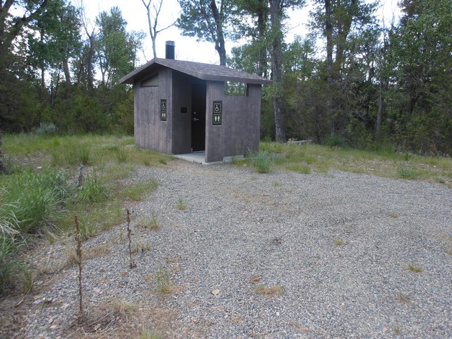 picture showing Accessible latrine 100' across from campsite # 17.  There is a 2-3