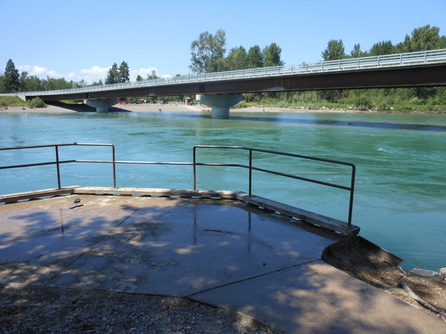 picture showing Nice fishing platform located at the access site on the east side of the river.  Deep fishing hole right in front of platform.