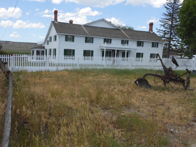 picture showing View of the historic ranch house from the paved trail that is 400 yards from the main parking lot.  Unloading/loading is available near the front of the house with parking available 300' away.  Tours of the main floor are available daily.  Staff members are very accommodating to people with disabilities.