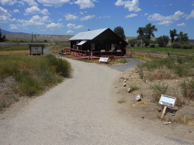 picture showing Visitor center right off of the main parking lot.  Paved trail system to visitor center and onto the historic ranch house that is 400 yards beyond.