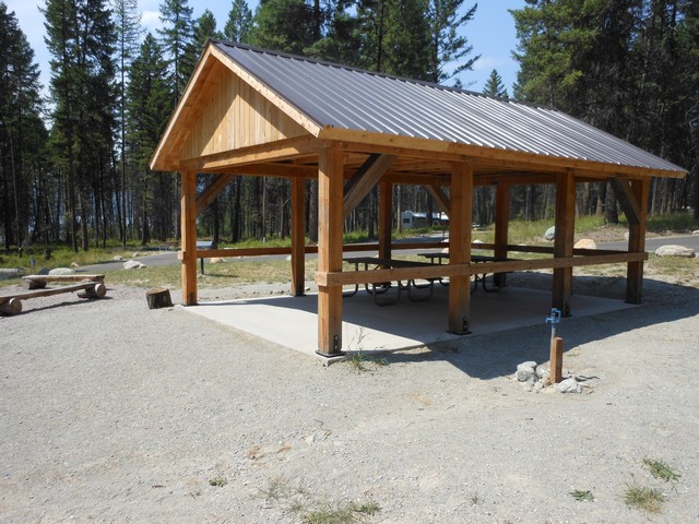 picture showing Group picnic shelter in the middle of the Group Camping Area.  However, there is not an accessible route to it.  It does have a large campfire ring to accommodate groups.