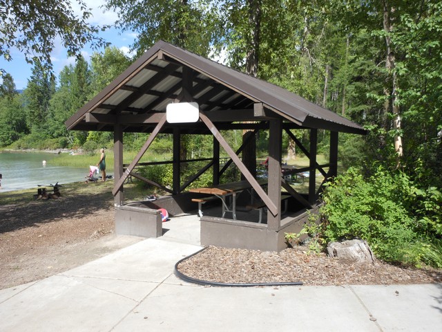 picture showing Picnic shelter overlooking beachfront.  Nice sidewalk from parking lot to the beach area.