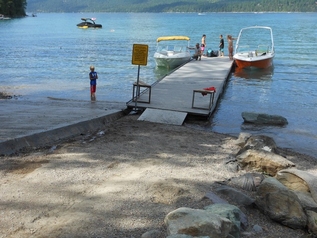 picture showing Boat launch area with ramp & dock.  The ramp has a max slope of 14.5%.  The dock has bull rail all the way around the perimeter of the dock.  It is 3