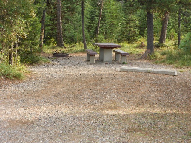 picture showing Campsite #18.  Even though it does not meet all of the accessibility standards, it does have fairly flat ground.  The max slope to campsite amenities is 2%, cross-slope is 1%.  The table and grill do not comply.