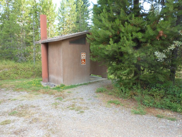 picture showing Accessible latrine adjacent to campsite #18 is 65' away.  There is a 2