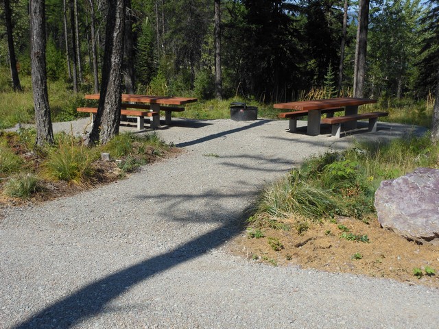 picture showing Double campsite #4 with accessible tables & fire grill.