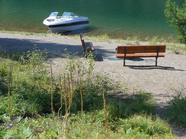 picture showing An inaccessible trail to a nice setting of benches and fire grill.