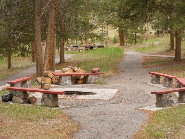 picture showing Large group fire-pit adjacent to the picnic shelter.