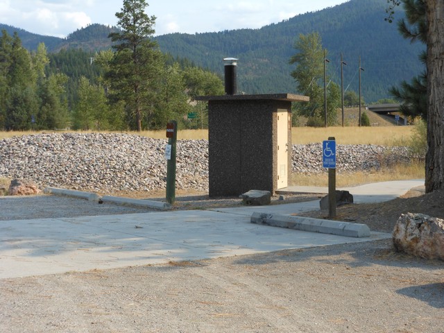 picture showing The accessible toilet at Beavertail Pond is located next to the marked accessible parking, and along the route to the accessible fishing platform.