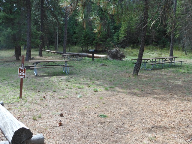 picture showing Group campsite #5 in loop A.  It has two tables that are accessible but the fire-grill is not.