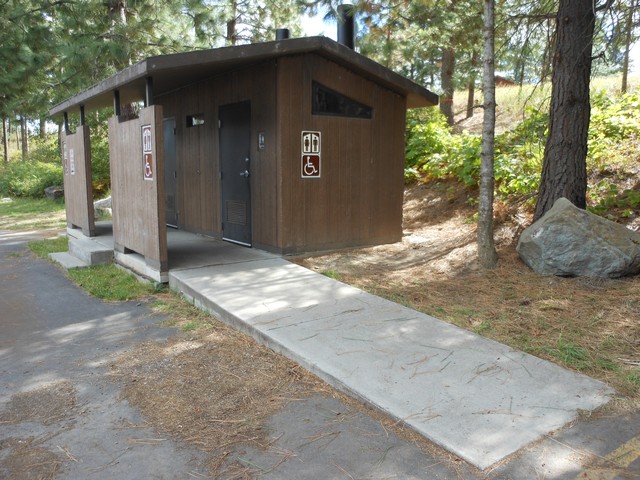 picture showing Accessible latrine adjacent to parking area.