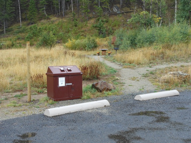 picture showing The trail to the picnic table is gravel and a little rough, especially transitioning off of the paving.