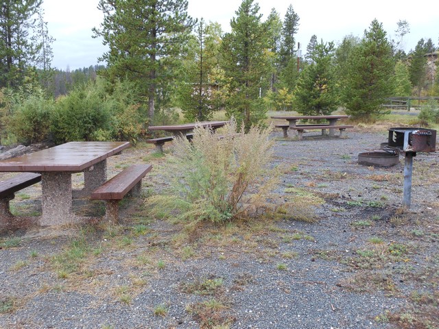 picture showing Small cluster of 3 accessible tables and 1 grill.  