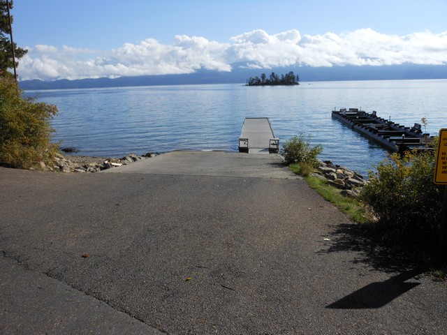 picture showing Boat launch area with ramp & dock.  The ramp has a 13% slope.  The dock has a bull rail around the perimeter.