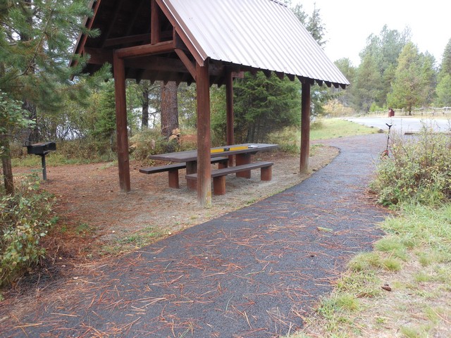 picture showing Accessible picnic shelter & fire grill in day-use area.