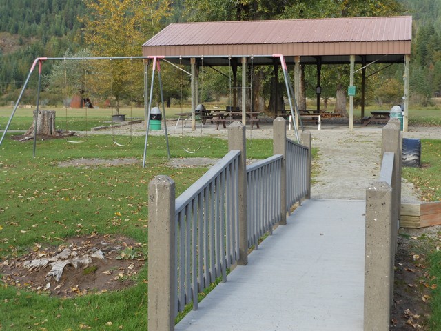 picture showing Foot bridge to access group picnic shelter and rest of playground area.