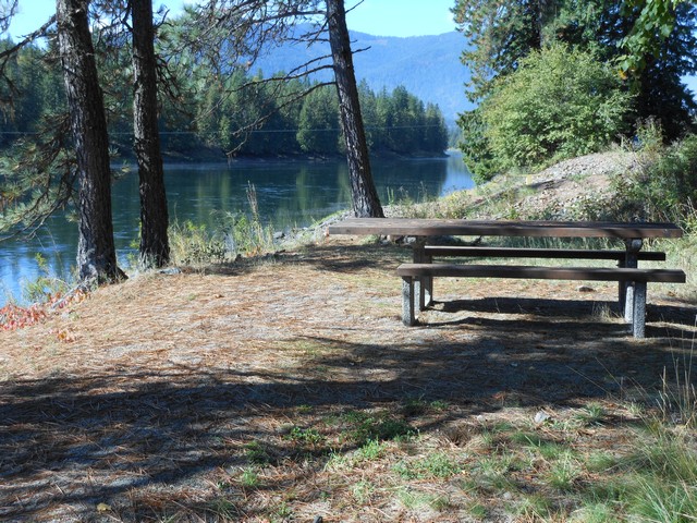 picture showing Single picnic table that is accessible, however, the route to the table does not meet accessibility standards. 