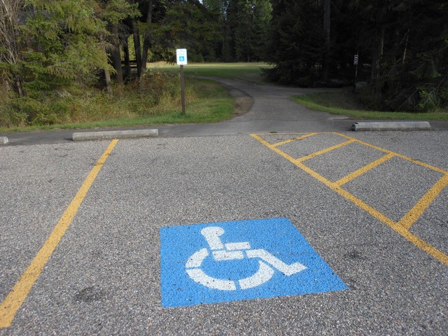 picture showing Accessible parking with pathway leading to group use picnic shelter #1.  The route has a max slope of 6.3% and a cross slope of 1.3%.