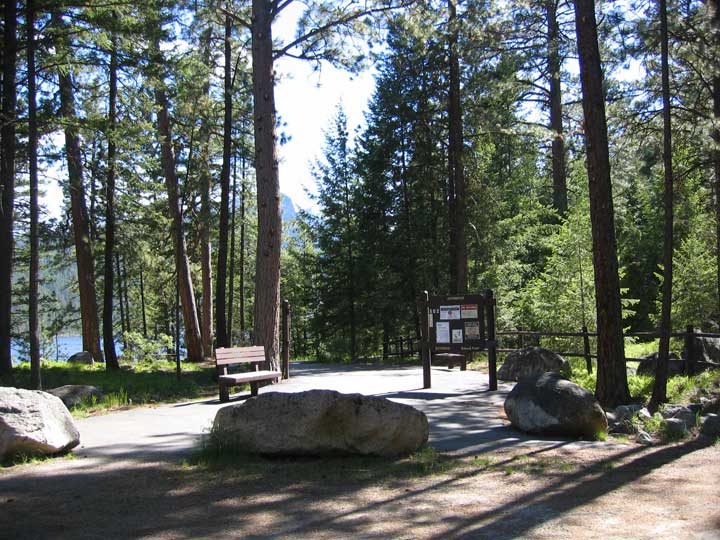 picture showing Trailhead for accessible 1/3 mile paved trail along Lake Como.  This is right before the upper campground.  There is a nice parking lot with an accessible latrine and parking space.