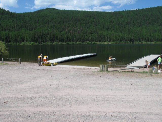 picture showing Boat launch area with two floating docks.  Apparently swimming is allowed on either side of the boat launch, but the docks have signs saying 'No swimming allowed.'  This boat launch is located in the southern day use area of the campground.