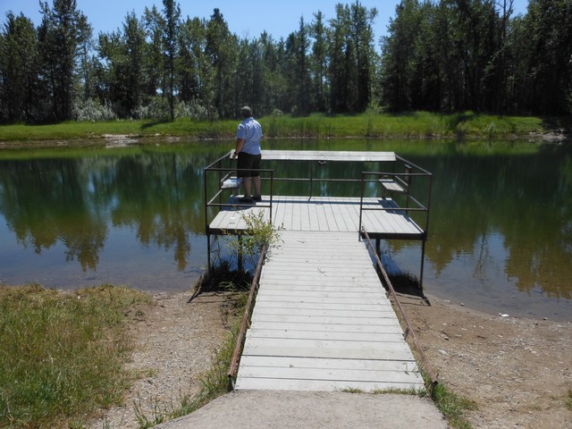 picture showing Nice fishing platform.  The guy in the photo had just caught a nice trout.